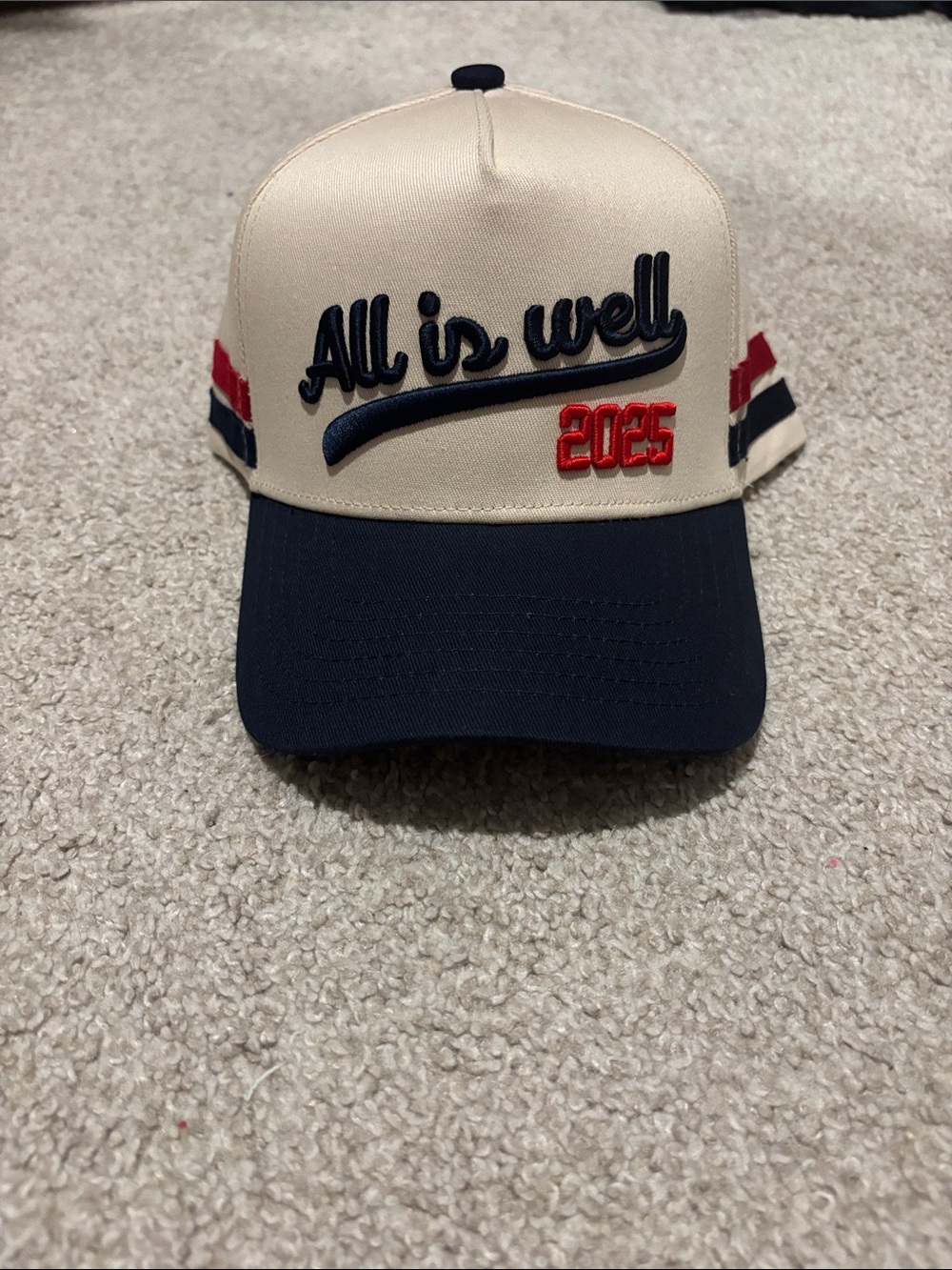 All Is Well 2025 Trucker Hat - Cream and Navy